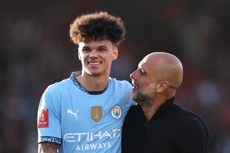 BOURNEMOUTH, ENGLAND - MARCH 30: Pep Guardiola, Manager of Manchester City, celebrates victory with Nico O'Reilly of Manchester City after the Emirates FA Cup Quarter Final match between AFC Bournemouth and Manchester City at Vitality Stadium on March 30, 2025 in Bournemouth, England. (Photo by Alex Pantling/Getty Images)