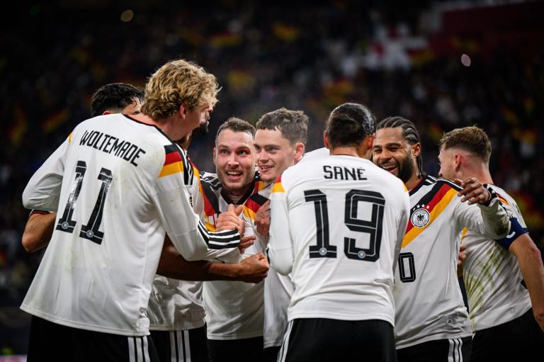 LEIPZIG, GERMANY - NOVEMBER 17: Leroy Sane (C) of Germany celebrates with Nick Woltemade, David Raum and Florian Wirtz and Serge Gnabry (L-R) his team's fourth goal during the FIFA World Cup 2026 qualifier match between Germany and Slovakia at Red Bull Arena on November 17, 2025 in Leipzig, Germany. (Photo by Marvin Ibo Guengoer - GES Sportfoto/Getty Images)